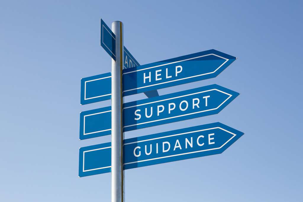 Signpost pointing to help, support, and guidance through counselling
