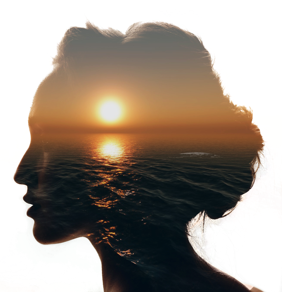 Woman's silhouette with ocean sunset — representing inner healing and trauma processing through EMDR therapy in Abbotsford, BC